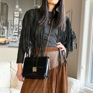 Black leather flap bag with leather and chain strap